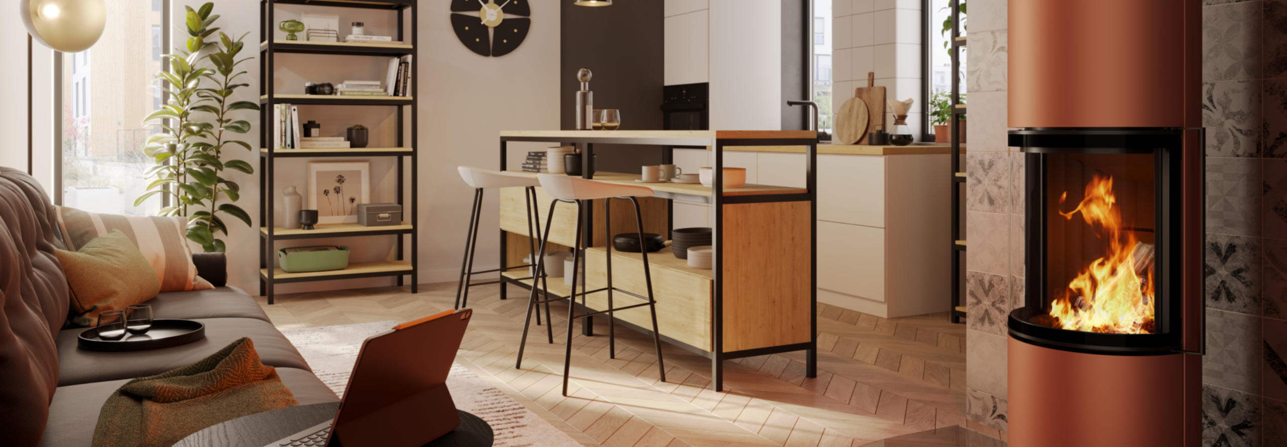 Kaminofen steht in einem Wohnzimmer an das eine offene Küche anschließt.